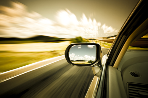 Driver's view of the side mirror while car is moving.