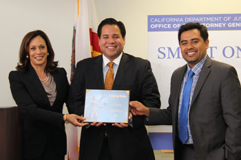 Ruben Gonzalez and Luis Barrera Castañón accept a Smart on Crime Award on behalf of the LA Area Chamber of Commerce.