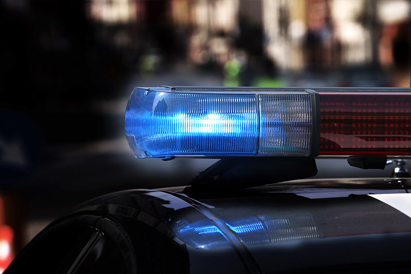 Blue and red lights on top of a police vehicle